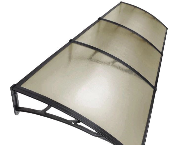 A 3 metre three-panel bronze-tinted polycarbonate awning on a white background